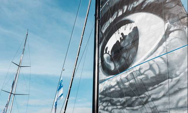 JR artist main sail's artwork on Vivoabeira, skippers Yoann Richomme and Pierre Lacaze during pre-start of the Transat Jacques Vabre 2017, duo sailing race from Le Havre (FRA) to Salvador de Bahia (BRA) in Le Havre on October 29th, 2017 - Photo Jean-Louis Carli / ALeA / TJV17