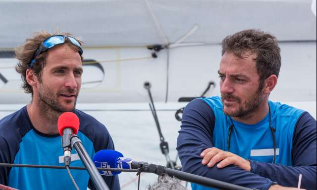 3rd place in Imoca category for Des Voiles et Vous, skippers Morgan Lagraviere and Eric Peron, at pontoon with media and officials, during arrivals of the duo sailing race Transat Jacques Vabre 2017 from Le Havre (FRA) to Salvador de Bahia (BRA), on November 19th, 2017 - Photo Jean-Marie Liot / ALeA / TJV17